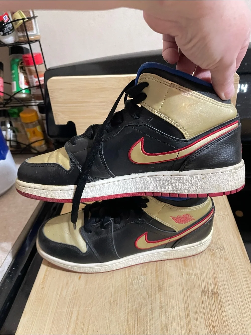 Nike Kids Black and Gold High-Top Sneakers with Blue Lining